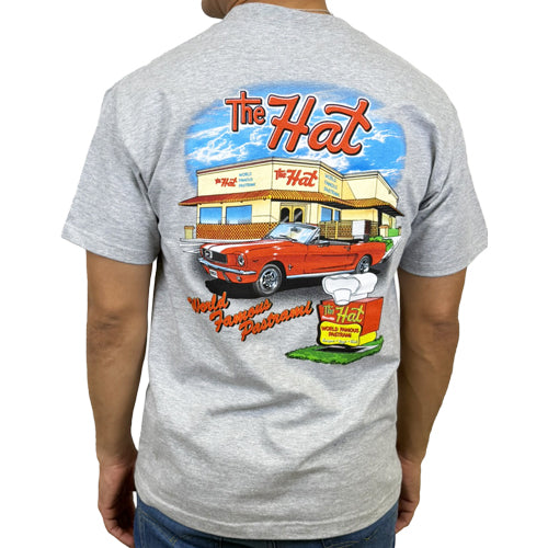Gray t-shirt with a colorful graphic of a restaurant and car on the back. The Hat restaurant logo men's short sleeve tee in grey